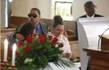  ?? AP ?? FINAL RESPECTS: Friends and family mourn Derrick Fudge on Saturday at a church in Springfiel­d, Ohio. Fudge, 57, was the oldest of nine who were killed when a gunman opened fire outside a bar early Sunday in Dayton, Ohio.