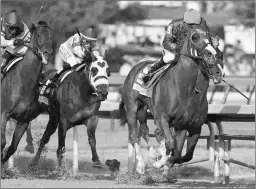  ?? JUSTIN N. LANE ?? Lucky Pulpit (top) broke the California single-season record for progeny earnings last year on the strength of his son California Chrome, here winning the 2014 Kentucky Derby.