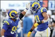  ?? Sean M. Haffey / Getty Images ?? The Broncos acquired linebacker Kenny Young, right, in a trade with the Rams on Monday.