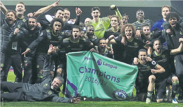  ??  ?? Chelsea players celebrate after winning the Premier League title.