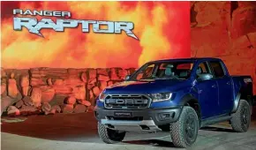  ??  ?? The much-anticipate­d Ford Ranger Raptor poses on stage during its Bangkok reveal.