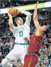  ?? AP PHOTO ?? Boston Celtics forward Jayson Tatum, left, goes to the hoop against Cleveland Cavaliers guard Rodney Hood during Sunday’s Game 1 of the Eastern Conference Finals in Boston.