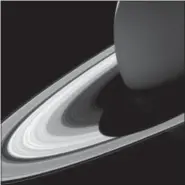  ?? NASA — JPL-CALTECH — SPACE SCIENCE INSTITUTE VIA AP ?? This image made available by NASA shows Saturn’s shadow on its rings as seen from the Cassini spacecraft. During its deliberate plunge Friday Cassini will keep sampling Saturn’s atmosphere and beaming back data, until the spacecraft loses control and...