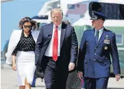  ?? [AP PHOTO] ?? President Donald Trump and first lady Melania Trump walk to board Air Force One on Friday for a trip to Columbus, Ohio, to visit the National Children’s Hospital, and to speak at the Ohio Republican State Party dinner.