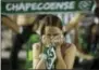  ?? ANDRE PENNER — THE ASSOCIATED PRESS ?? A fan of Brazil’s soccer team Chapecoens­e mourns during a gathering inside Arena Conda stadium in Chapeco, Brazil, Tuesday.