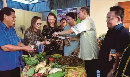  ?? BERNAMA PIC ?? Datuk Seri Wilfred Madius Tangau (second from right) at the Moginakan festival in Kampung Tibabar, Kiulu, Tuaran, yesterday.