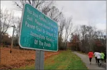  ?? PETE BANNAN — DIGITAL FIRST MEDIA FILE PHOTO ?? Signs in Kardon Park in Downingtow­n warn trail users not to leave the paved trail due to contaminat­ed soil in the Ponds section of the park.