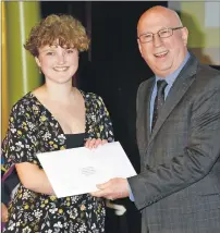  ??  ?? Higher Education Student of the Year Rachel Bradley is presented with her award by guest speaker Ken Bruce.