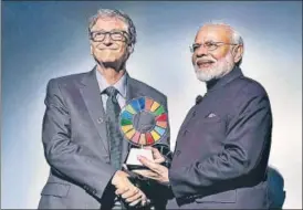  ?? PTI ?? Prime Minister Narendra Modi receives the Global Goalkeeper Award by Bill and Melinda Gates Foundation from co-founder Bill Gates for the Swachh Bharat Abhiyan launched by his government, in New York on Wednesday.