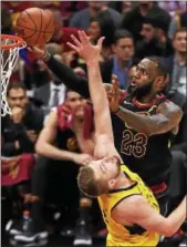  ?? TIM PHILLIS — THE NEWS-HERALD ?? LeBron James goes to the basket against the Pacers’ Domantas Sabonis on April 25 at Quicken Loans Arena.