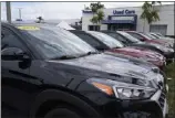  ?? MARTA LAVANDIER ASSOCIATED PRESS ?? A line of used cars sits for sale at the Potamkin Hyundai dealer in February in Miami Lakes, Fla. U.S. new vehicle sales tumbled more than 21% in the second quarter.