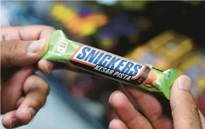  ?? ?? A Snickers bar from India on Aug. 7 at Exotic Snack Guys on Lincoln Avenue in Chicago.