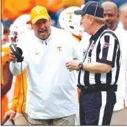  ?? (AP file photo) ?? Tennessee Coach Jeremy Pruitt (left) received a two-year extension and a pay raise that will have him making $4.2 million in 2021.