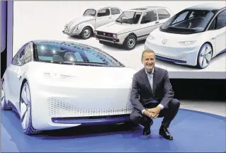  ?? MICHEL EULER / ASSOCIATED PRESS ?? Volkswagen CEO Herbert Deiss introduces the new Volkswagen electric car during a press conference at the Paris Motor Show in Paris on Thursday.