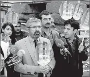  ?? AP/ILYAS AKENGIN ?? Tahir Elci, the head of the Diyarbakir Bar Associatio­n, speaks at a news conference Saturday shortly before he was fatally shot in Diyarbakir, Turkey.