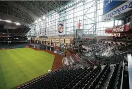  ??  ?? The removal of Tal’s Hill gives center field a different look, left, at Minute Maid, where the Astros will host the Cubs in exhibition games tonight and Friday.