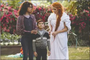  ?? The Associated Press ?? LOVE CONQUERS: Storm Reid, from left, Deric McCabe and Reese Witherspoo­n in a scene from "A Wrinkle In Time."