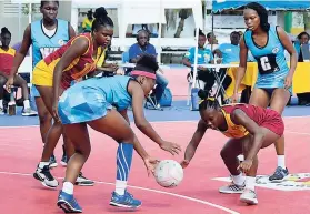  ??  ?? Springers Shorile Seale (left) is challenged by Holmwood Technical’s Ryoho Jones during a semi-final match of the AFNA Champion of Champions High School netball tournament held at the Leila Robinson Courts yesterday.