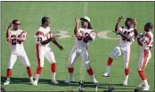  ?? AL BEHRMAN — THE ASSOCIATED PRESS FILE ?? Cincinnati Bengals fullback Ickey Woods, center, and teammates do their dance for the media at Super Bowl Media Day in Miami on Jan. 17, 1989.