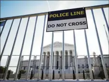  ?? Getty Images ?? A view of the U.S. Supreme Court through security fencing on June 1 in Washington, D.C.