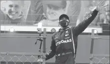  ?? AFP ?? Right: Hamilton waves to the crowd after his historic win.