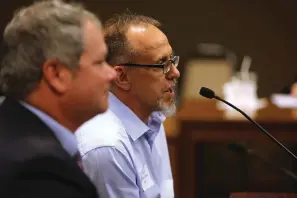  ?? Arkansas Democrat-gazette/thomas Metthe ?? Dr. Robert Karas, right, speaks while sitting alongside his attorney, Kyle Unser during Karas’s appearance before the Arkansas State Medical Board on Thursday in Little Rock.