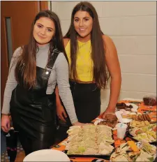  ??  ?? Laurna Mulcahy and Rachel McCarthy (whose father, John, is manager of Bank of Ireland’s Dingle branch) providing tea and sandwiches at the Dingle Enterprise Town event in Pobalscoil Chorca Dhuibhne on Friday night. Photo by Declan Malone