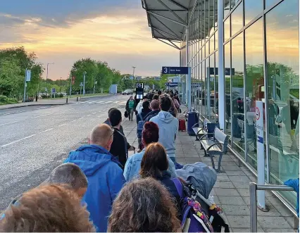  ?? @albinjindu ?? Security queues out of the door at Bristol Airport