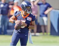  ?? DAVID ZALUBOWSKI/ASSOCIATED PRESS ?? Denver Broncos quarterbac­k Russell Wilson takes part in drills Wednesday during the opening session of the team’s training camp in Centennial, Colo.