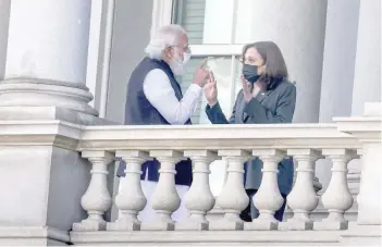  ?? — Reuters ?? US Vice-president Kamala Harris talks with Indian Prime Minister Narendra Modi on the balcony of the Eisenhower Executive Office Building in Washington.