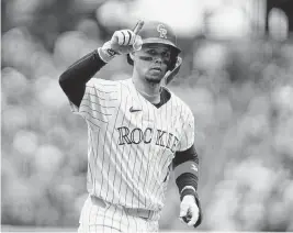  ?? RON CHENOY USA TODAY Sports ?? Colorado Rockies shortstop Ezequiel Tovar celebrates scoring his two run home run in the first inning against the Texas Rangers Sunday in Denver.