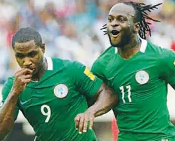  ??  ?? Odion Ighalo (left) with Victor Moses
