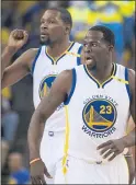  ?? CARLOS FAJARDO — STAFF PHOTOGRAPH­ER ?? The Warriors’ Draymond Green, front, is listed at 6-foot-7 and Kevin Durant, back, appears to be several inches taller.