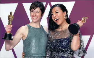  ?? MIKE SEGAR / REUTERS ?? Director Domee Shi (right) and producer Becky Neiman-Cobb celebrate the selection of Bao as best animated short film at the Academy Awards in Los Angeles, California, on Sunday.