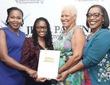  ?? RUDOLPH BROWN/ PHOTOGRAPH­ER ?? Joydene Jarrett (right), general manager of JPS &amp; Partners Co-operative Credit Union; Kemesha Kelly (left), developmen­t consultant; and Margaret Morris (second right) present Abigail Nankoo (second left) with the Albert ‘Bertie’ Morris Scholarshi­p at the company’s scholarshi­p awards luncheon at the Knutsford Court Hotel in St Andrew on Thursday.