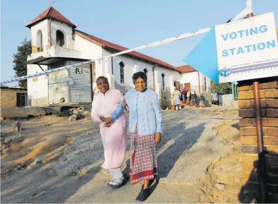  ?? Picture: EPA ?? ON THE SLOPE. A woman is helped away after casting her vote during elections. The Electoral Commission of SA says it is preparing itself for an onslaught on its reputation. ‘If the entity that runs the elections is discredite­d, that is half the battle won,’ it says.