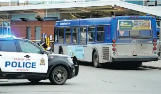  ?? LARRY WONG ?? Police investigat­e the stabbing of a 65-year-old bus driver at the Mill Woods Transit Centre on Wednesday amid a surge in operator assaults. The victim was sent to hospital and is expected to physically recover.