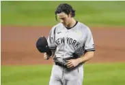  ?? Nick Wass / Associated Press ?? Yankees starting pitcher Gerrit Cole pauses on the mound in the fourth inning of a loss in Baltimore.