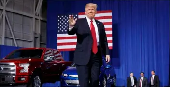  ?? PHOTO/EVAN VUCCI ?? President Donald Trump waves as he arrives to speak at the American Center of Mobility in Ypsilanti Township, Mich., on March 15. AP