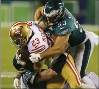  ?? (AP/Chris Szagola) ?? San Francisco 49ers running back Christian McCaffrey is tackled by Philadelph­ia Eagles linebacker Christian Elliss in the 2023 NFC Championsh­ip Game on Jan. 29, 2023, in Philadelph­ia. The 49ers are back in the NFC title game for the third season in a row and will host the Detroit Lions on Sunday in Santa Clara, Calif.