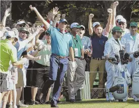  ?? AP PHOTOS ?? FEEL GOOD STORIES: Runner-up Justin Rose (top right) is gracious in defeat, congratula­ting Sergio Garcia on his playoff victory yesterday at the Masters in Augusta, Ga. Above, Matt Kuchar celebrates with the patrons after making a hole-in-one at No. 16.