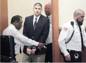  ??  ?? MASSACHUSE­TTS: In this Monday, Dec. 23, 2013, file photo, former New England Patriots NFL football player Aaron Hernandez is led into his court appearance at the Fall River Superior Court in Fall River, Mass. Massachuse­tts prison officials said...