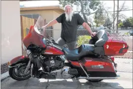  ?? MARTIN S. FUENTES/ LAS VEGAS REVIEW-JOURNAL ?? Vietnam War veteran Joseph Konicek shows his Harley-Davidson motorcycle at his Las Vegas home on Tuesday. When riding, “I only feel good then,” he says.