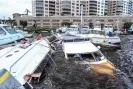  ?? Giorgio Viera/AFP/Getty Images ?? Boat are partially submerged at a marina in the aftermath of Hurricane Ian in Fort Myers, Florida, on Thursday. Photograph: