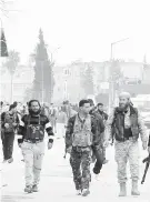  ??  ?? Milicianos extremista­s tras tomar Idlib, que se teme se torne en base de al Nustra, ala siria de al Qaeda.