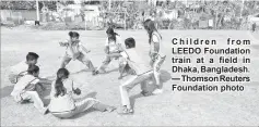  ??  ?? Children from LEEDO Foundation train at a field in Dhaka, Bangladesh. — Thomson Reuters Foundation photo