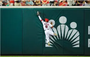 ?? (Reuters) ?? WASHINGTON NATIONALS centerfiel­der Ben Revere makes a leaping catch of a ball hit by Cleveland’s Roberto Perez during the sixth inning of a game the visiting Indians won 3-1 on Tuesday night.