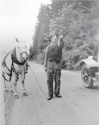  ??  ?? Major James MacFarlane, seen on Mill Bay Road, drove the provincial government to build a route over the Malahat. The road opened in 1911.