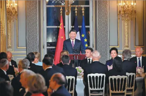  ?? YIN BOGU / XINHUA ?? President Xi Jinping addresses the welcoming banquet hosted by French President Emmanuel Macron at the Elysee Palace in Paris on Monday evening.