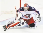  ?? Nick Wass / Associated Press ?? Columbus goalie Sergei Bobrovsky makes one of his 54 saves in an overtime victory over Washington.